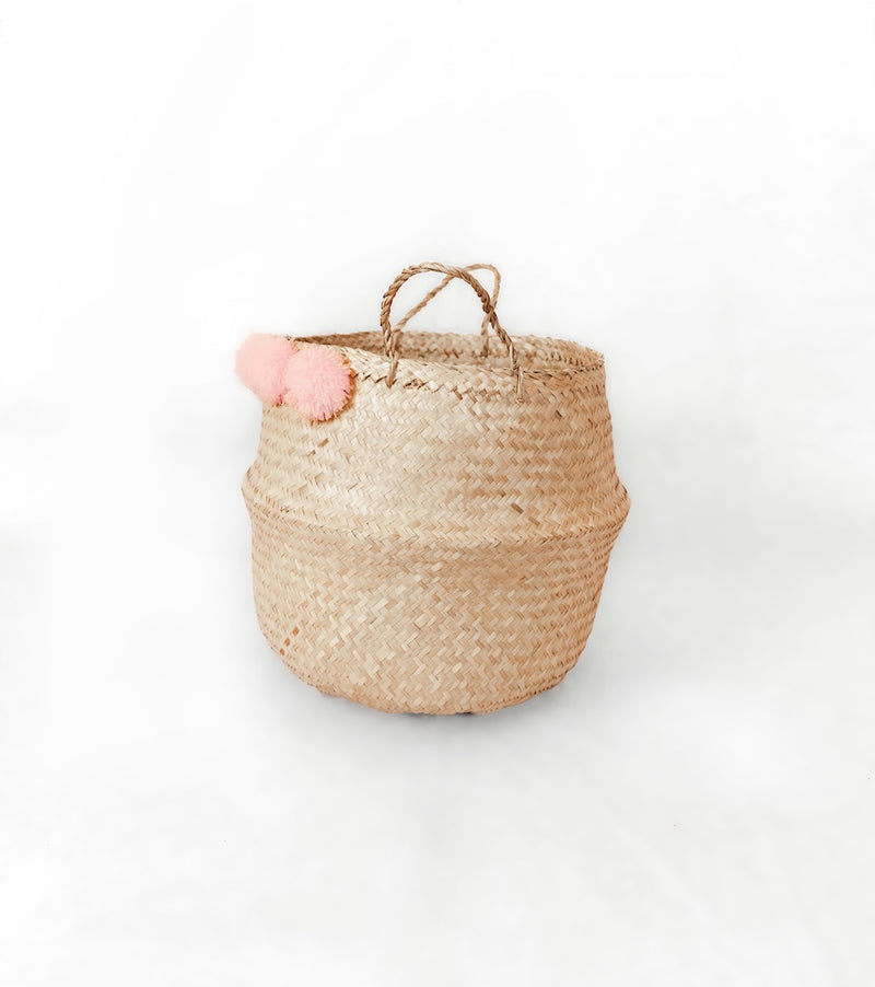 Sea grass belly basket with blush pom poms